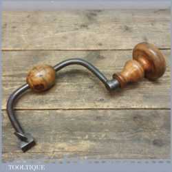 Antique steel brace with boxwood handles and original tightening screw