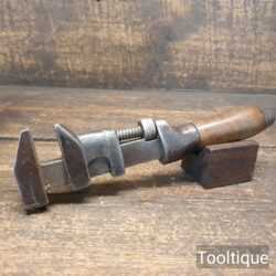Vintage automotive adjustable spanner wrench with wooden handle, in good used condition.